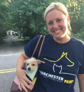 Lady Carrying Puppy in Purse